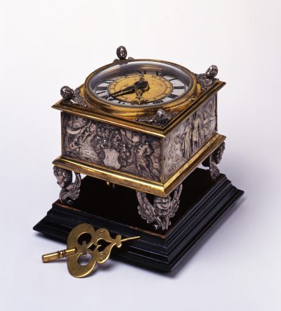 Table clock in sqare shape with splendid reliefs depicting the continents.